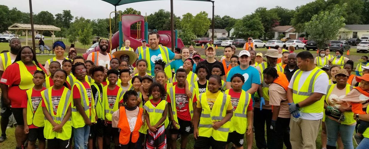 children and community wearing safety vests at Killeen Parks open space