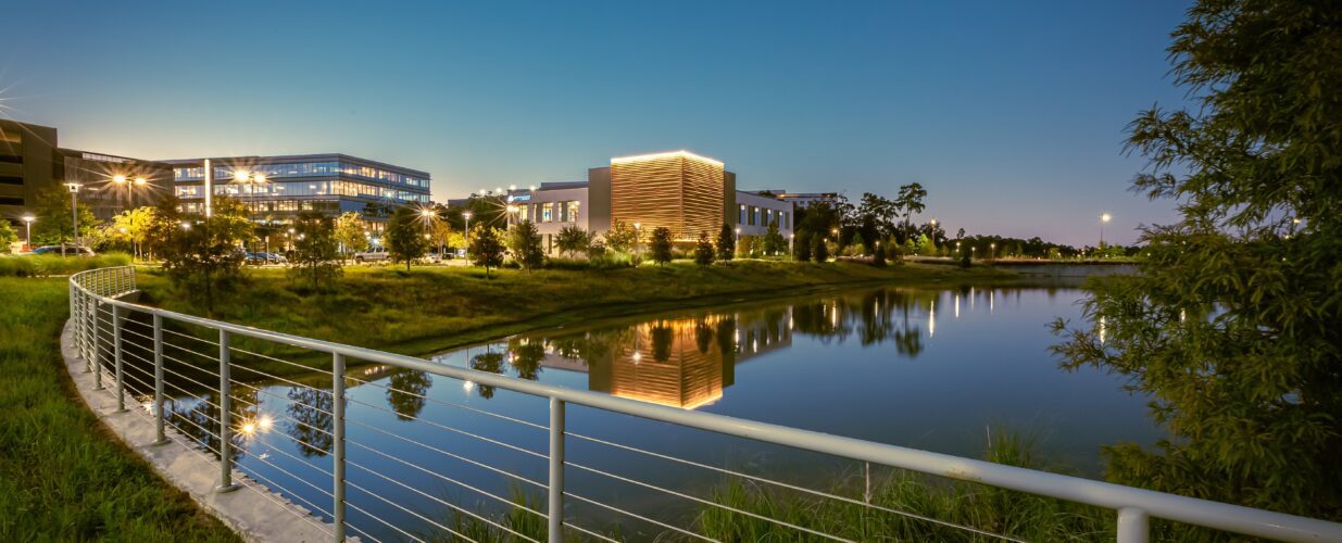 City Place buildings next to lake in the evening with lights